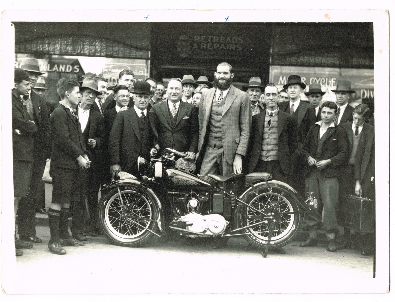Denis Dease (centre, wearing a hat) with one of his wrestlers