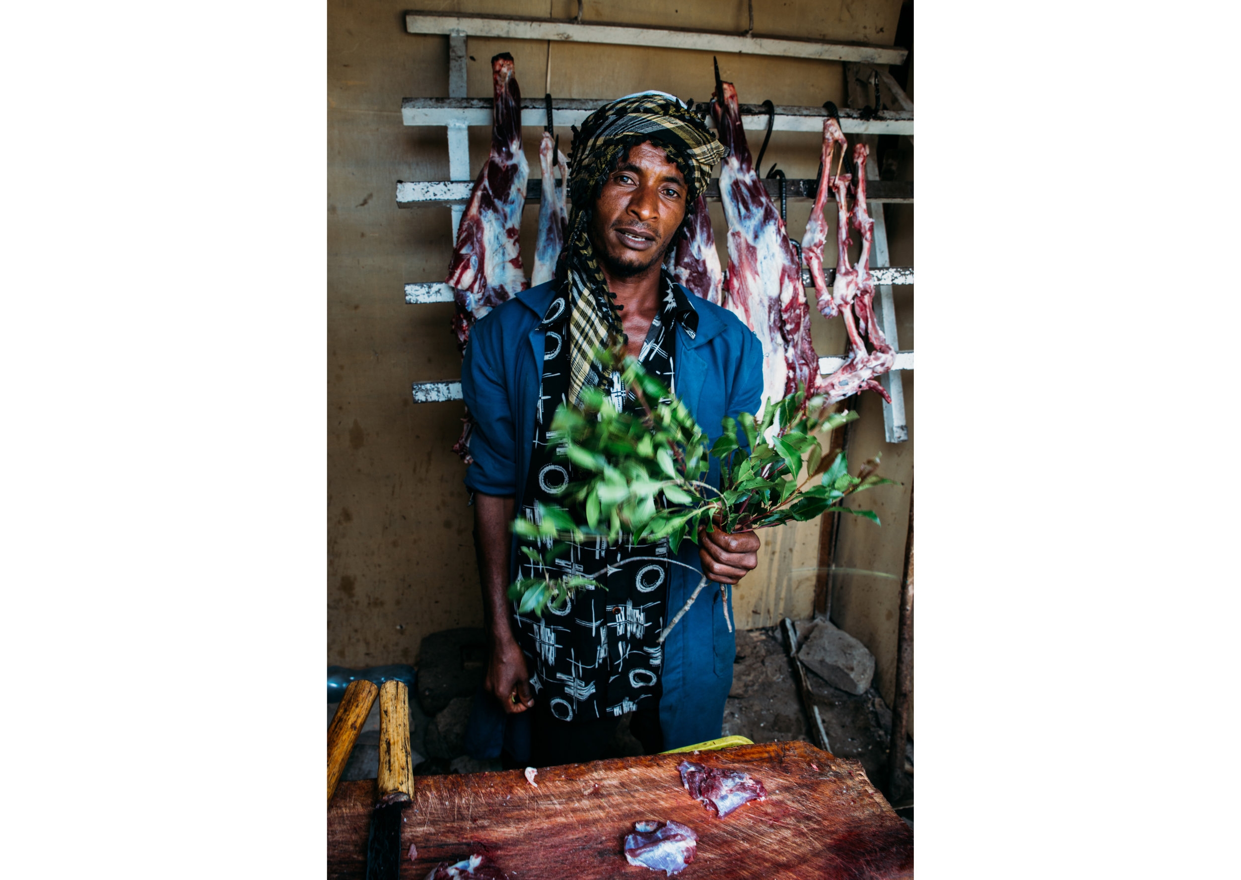 butcher with khat - between Gambela and Addis Ababa, Ethiopia