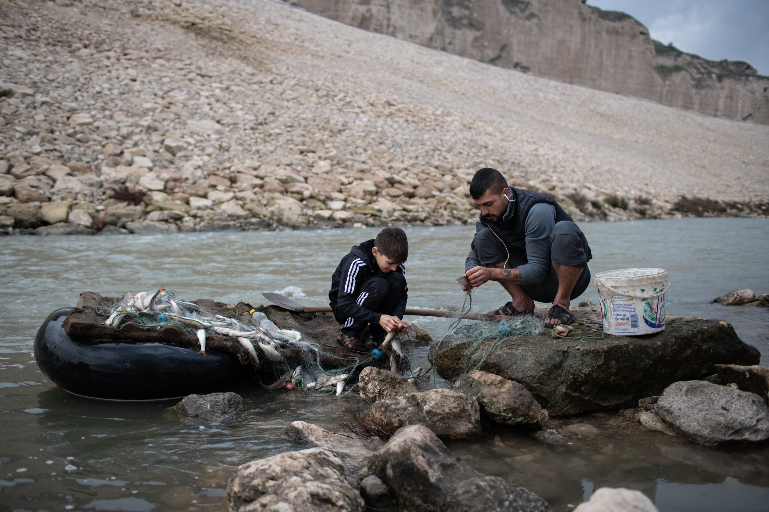 Devran and his nephew process fish from set nets. 