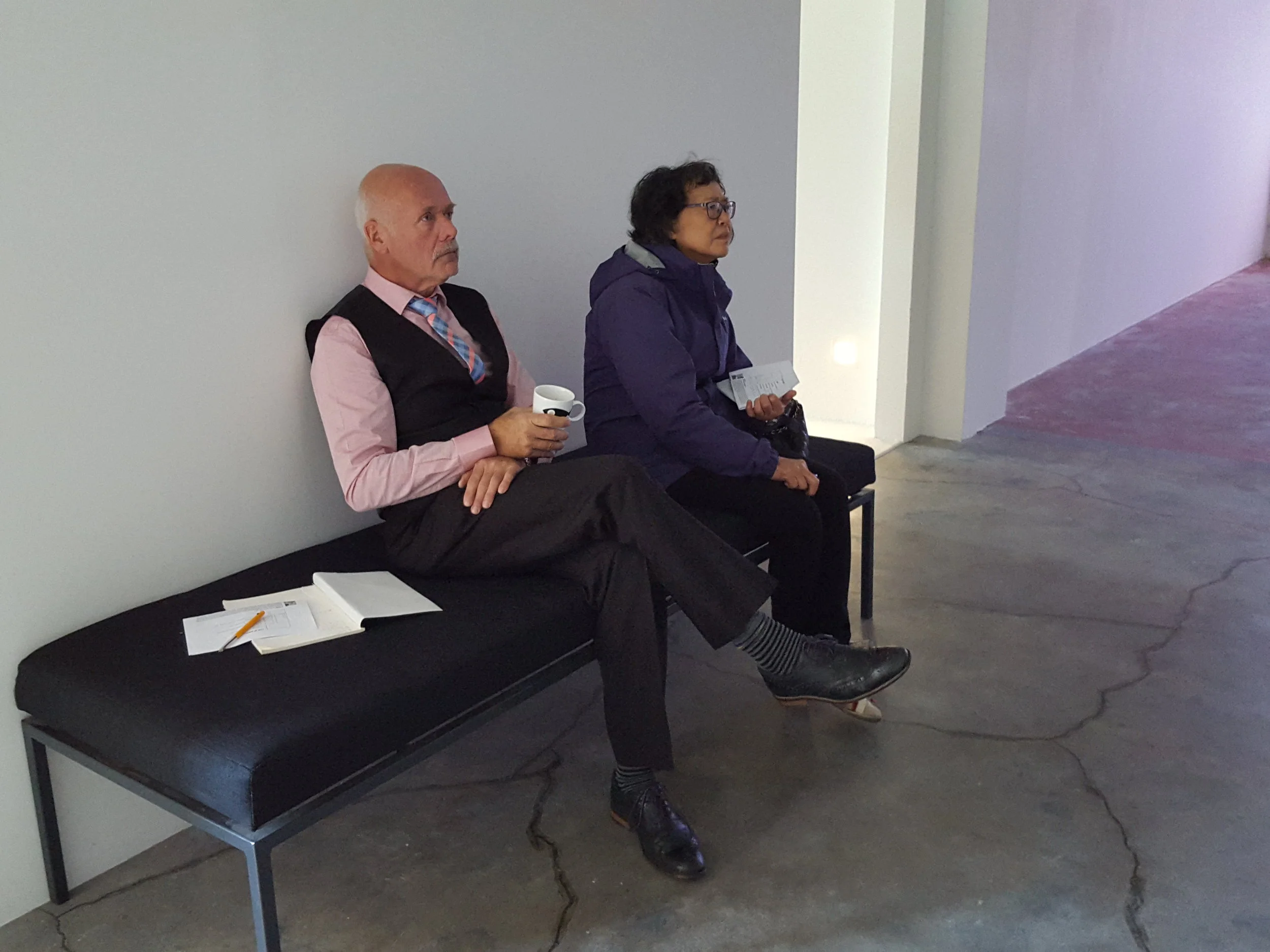  Our parents hard at work judging Clarchat Scintal's video installation. 