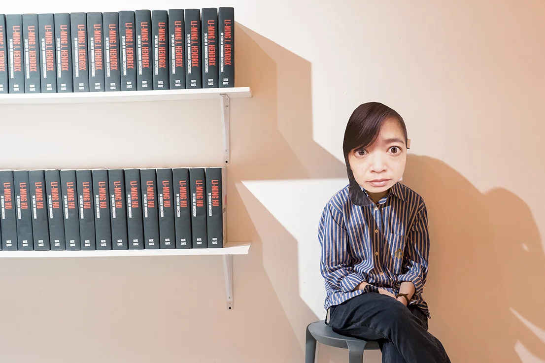 I also had performers wearing masks of myself inhabit the space throughout the evening, and also encouraged them to wander through the rest of the space and observe the other performances at the festival. Picture here is Chia Huang beside a set of fake artist monographs I had made for myself in echo of the large Zhou Brothers book displays upstairs in and outside the bar area.