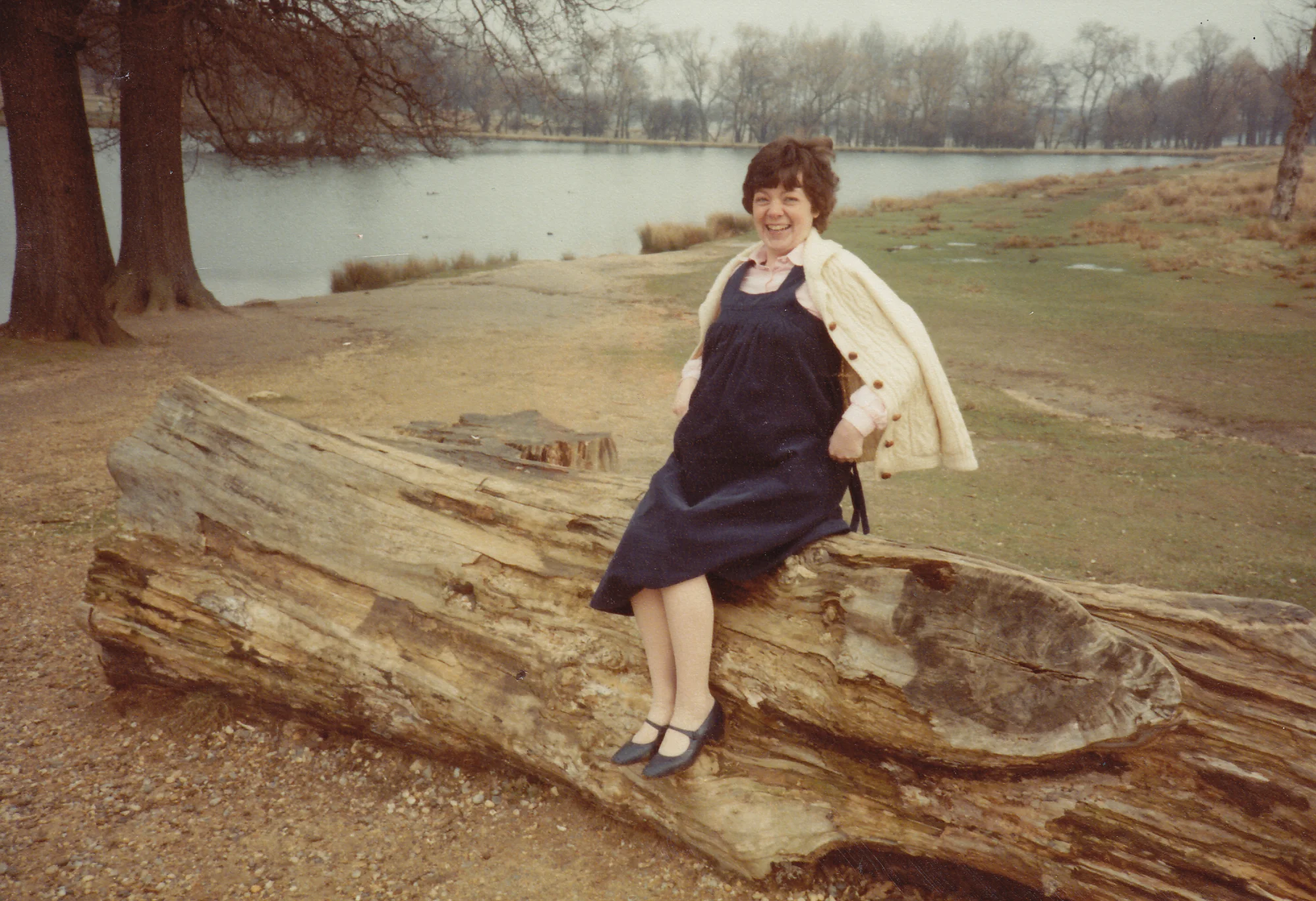 Bernadette sitting on log.jpg