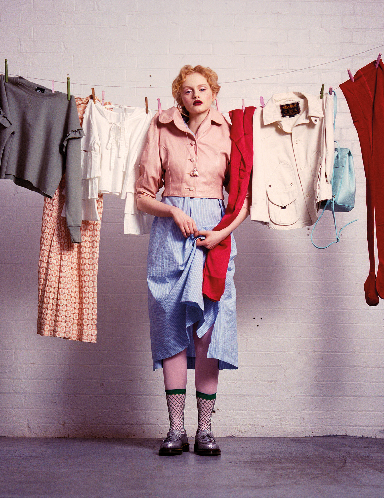 Emma wears: Shirt dress, Bamford; Jacket, Visoko Studios; Shoes, Dr Martens Vegan; Tights and socks, Stylist's own; Necklace, Gung Ho / On washing line: Green socks, Thought; Green jumper, Blitz Remix; Dress, Visoko Studios; White shirt, Ilk &amp; Ernie; Red scarf, Thought; Jacket, Blitz Vintage; Bag, Baia from Studio B; Red tights, Thought