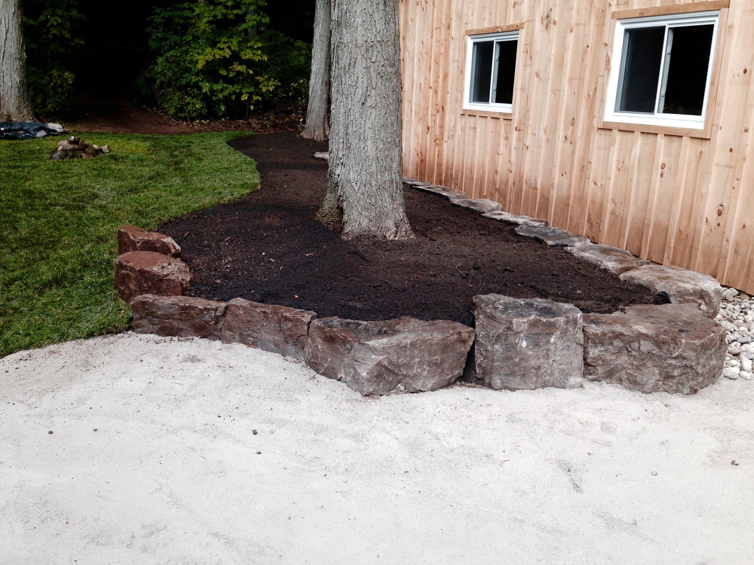 Armour Stone Wall with Fresh Sod