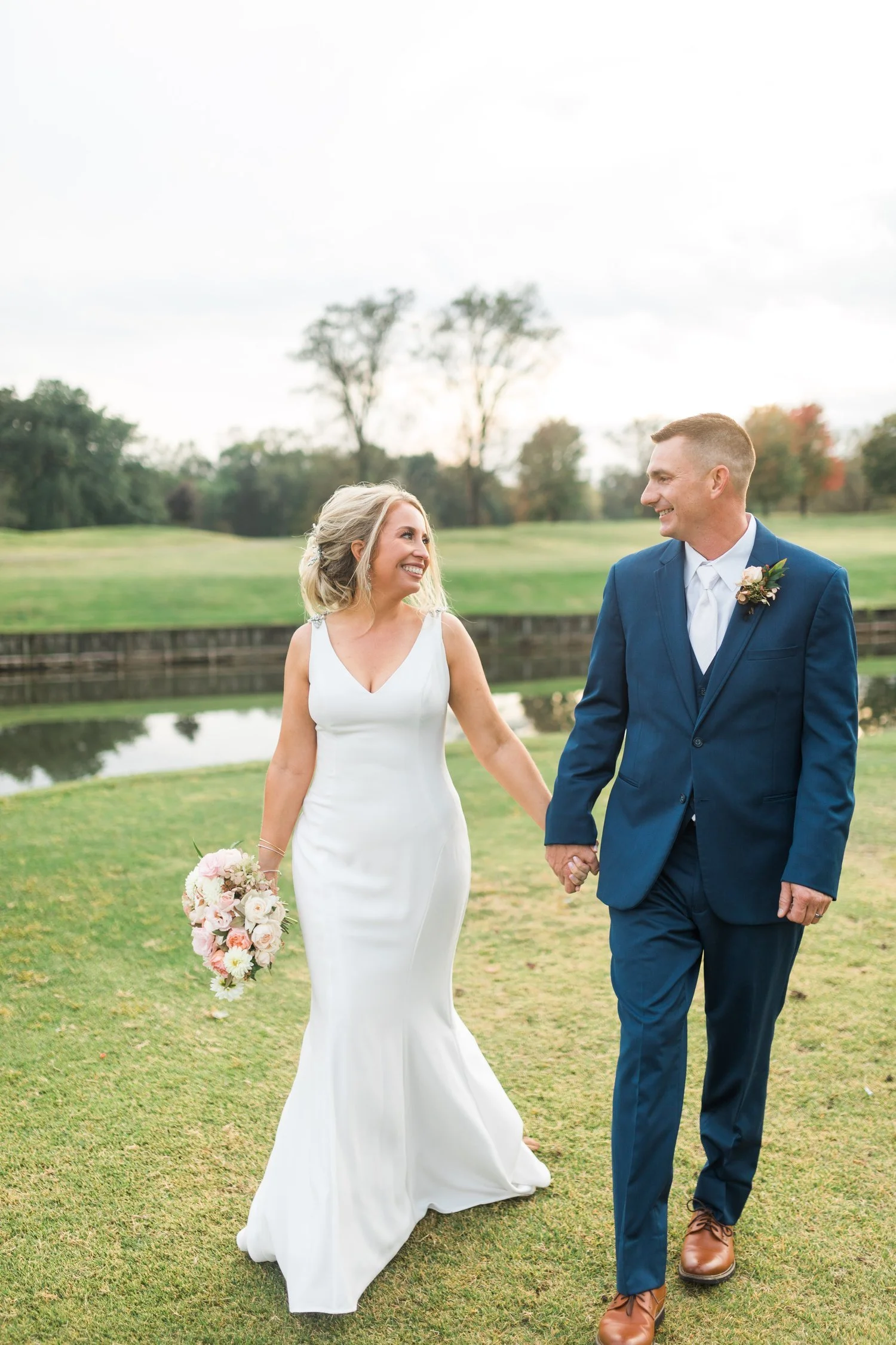 wedding couple standing on golf course