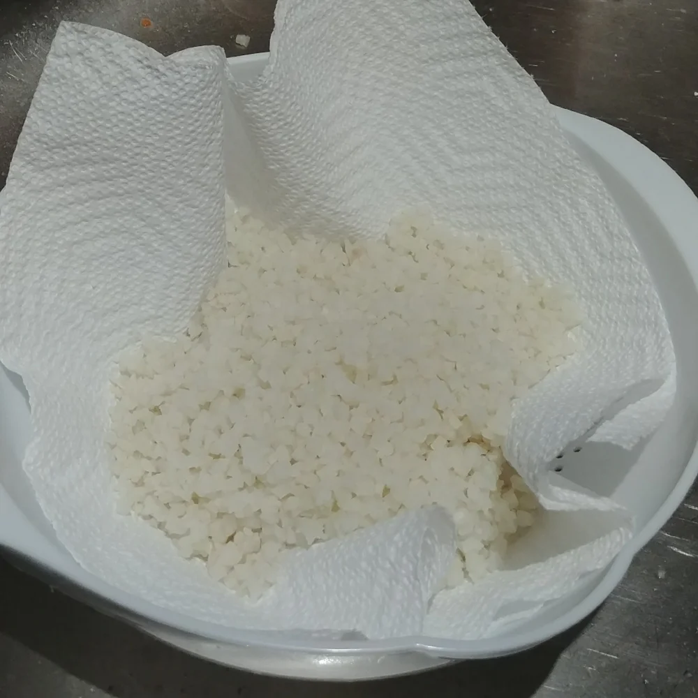 A cheesecloth would be the perfect tool for this, but a paper towel and a collander works great too! 
