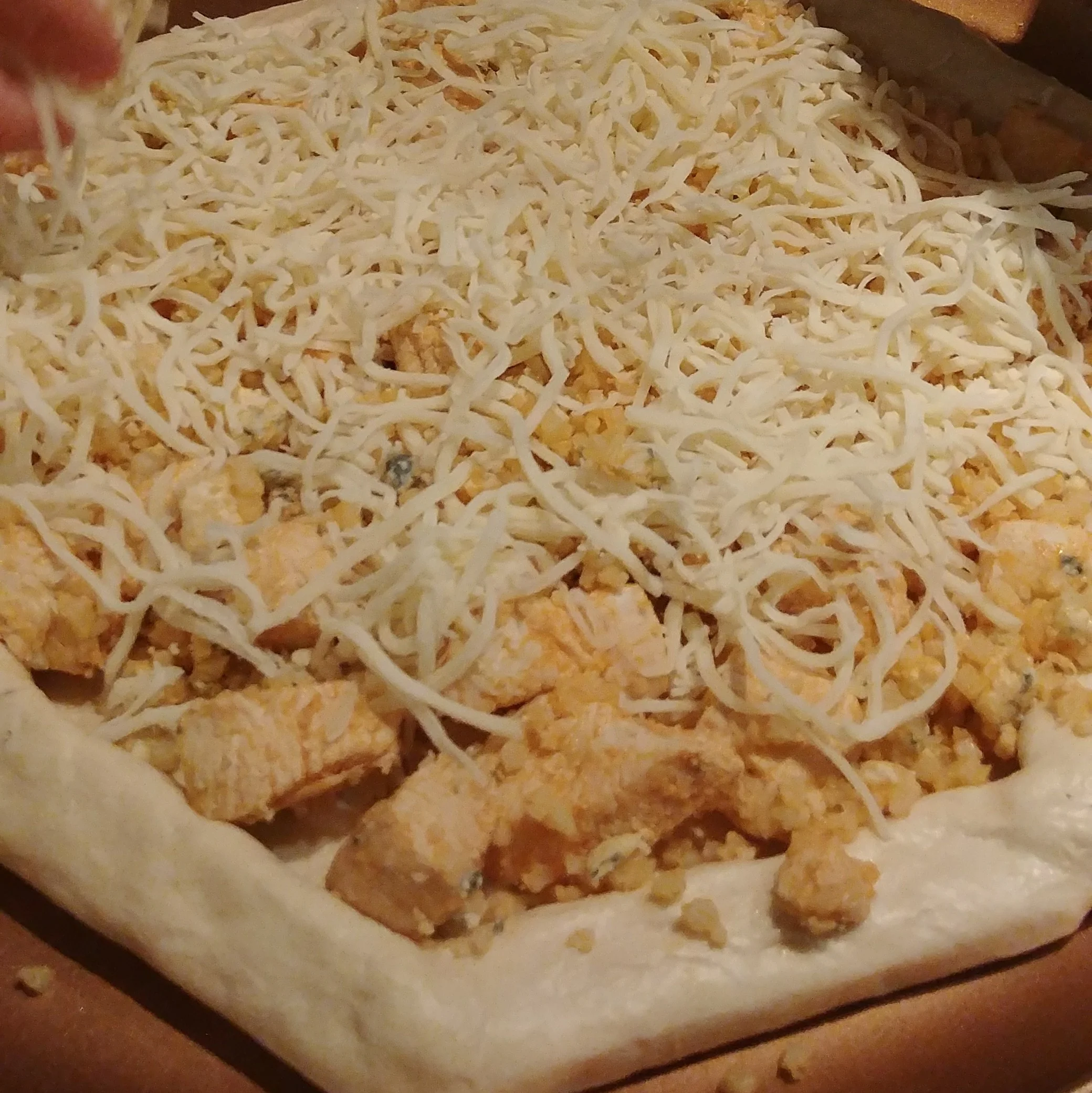 We really stuff it with chicken, so that's why we call it a pizza....pie. Obviously add as little or as much chicken as you'd like. Just make sure your crust is not too thin! 