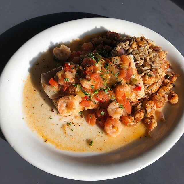 Grilled Mahi Mahi topped with shrimp creole and served with crawfish rice