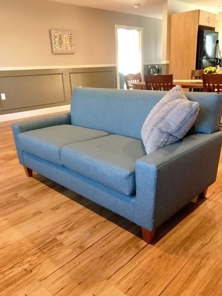 Syracuse Loveseat with Walnut Legs and Vinyl Decking