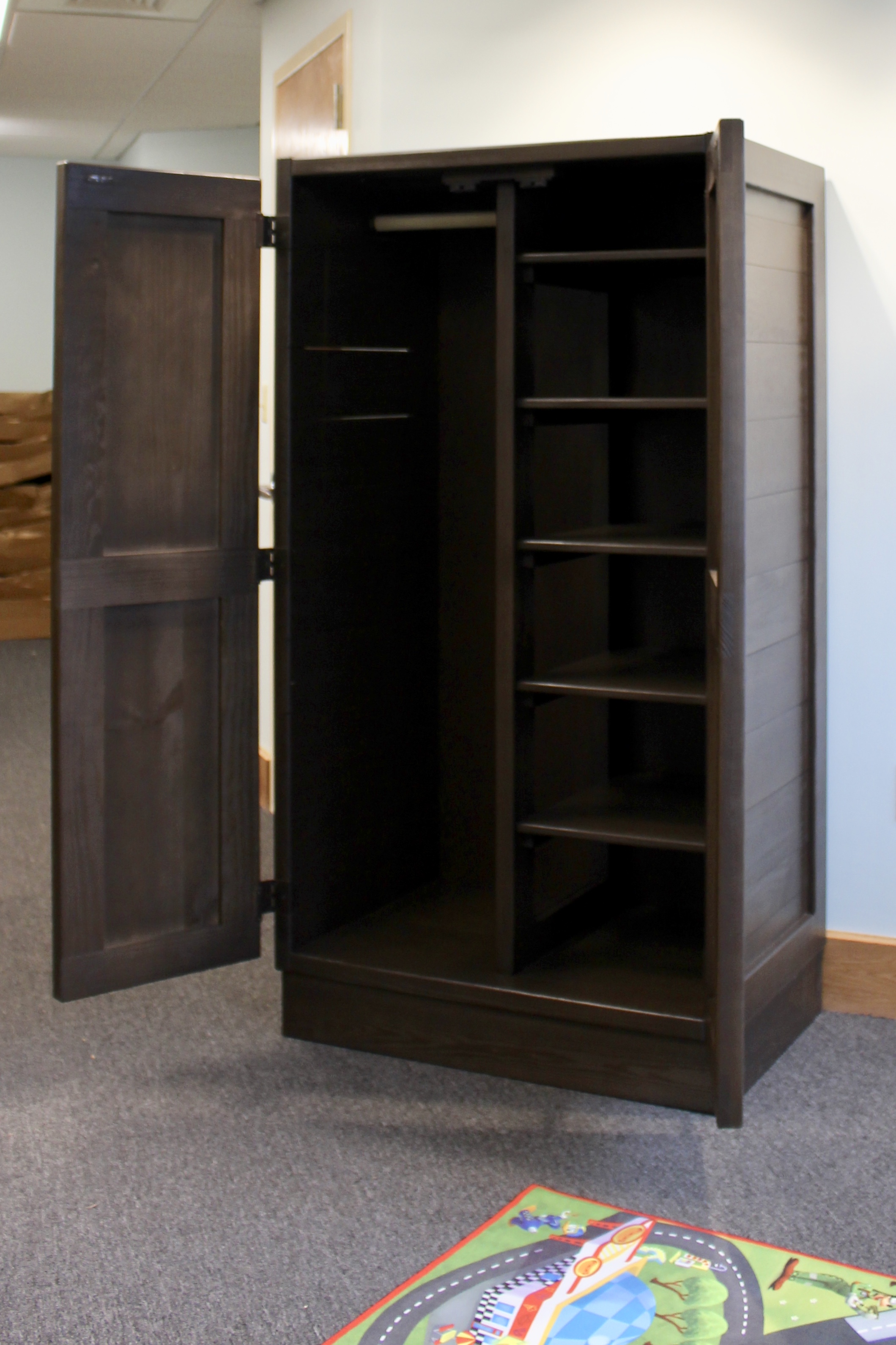 Classic wardrobe (Contract premium shown above $745, Standard 595) in espresso Being used in common area as storage for games and toys. can be built with all shelving. locking mechanism available for Behavioral Health and Education Agency