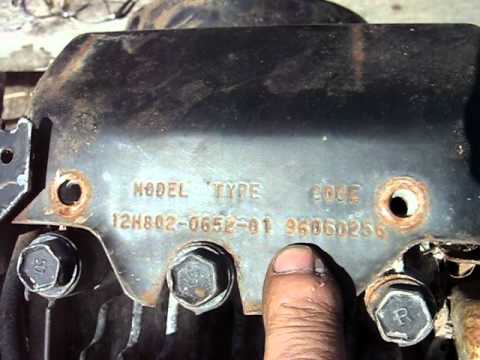 The model number for newer Briggs and Stratton engines is typically stamped onto the valve cover. Older models the location will vary, it should be on a metal plate somewhere on the engine or stamped directly onto a tab or the engine as shown above.