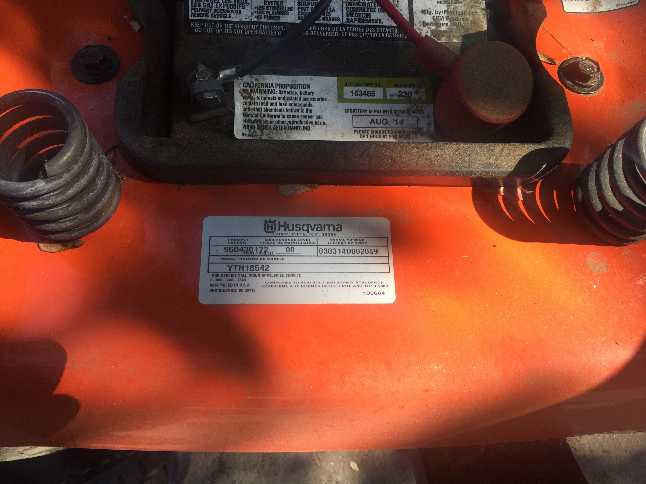 Husqvarna, and various other brands, model information is under seat of tractor.