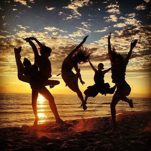 Our dancers leaping on the beach. Lake Michigan in the summer is Heaven.