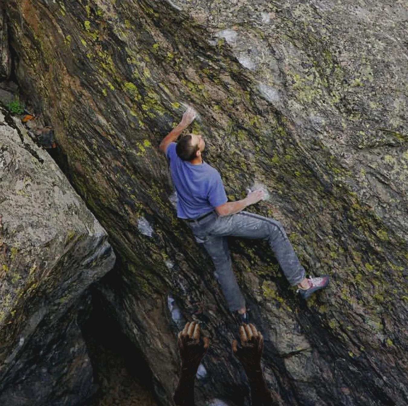 Avid climber, Nate Davison climbs through a crux with a Sasquatch as his trusty spotter.