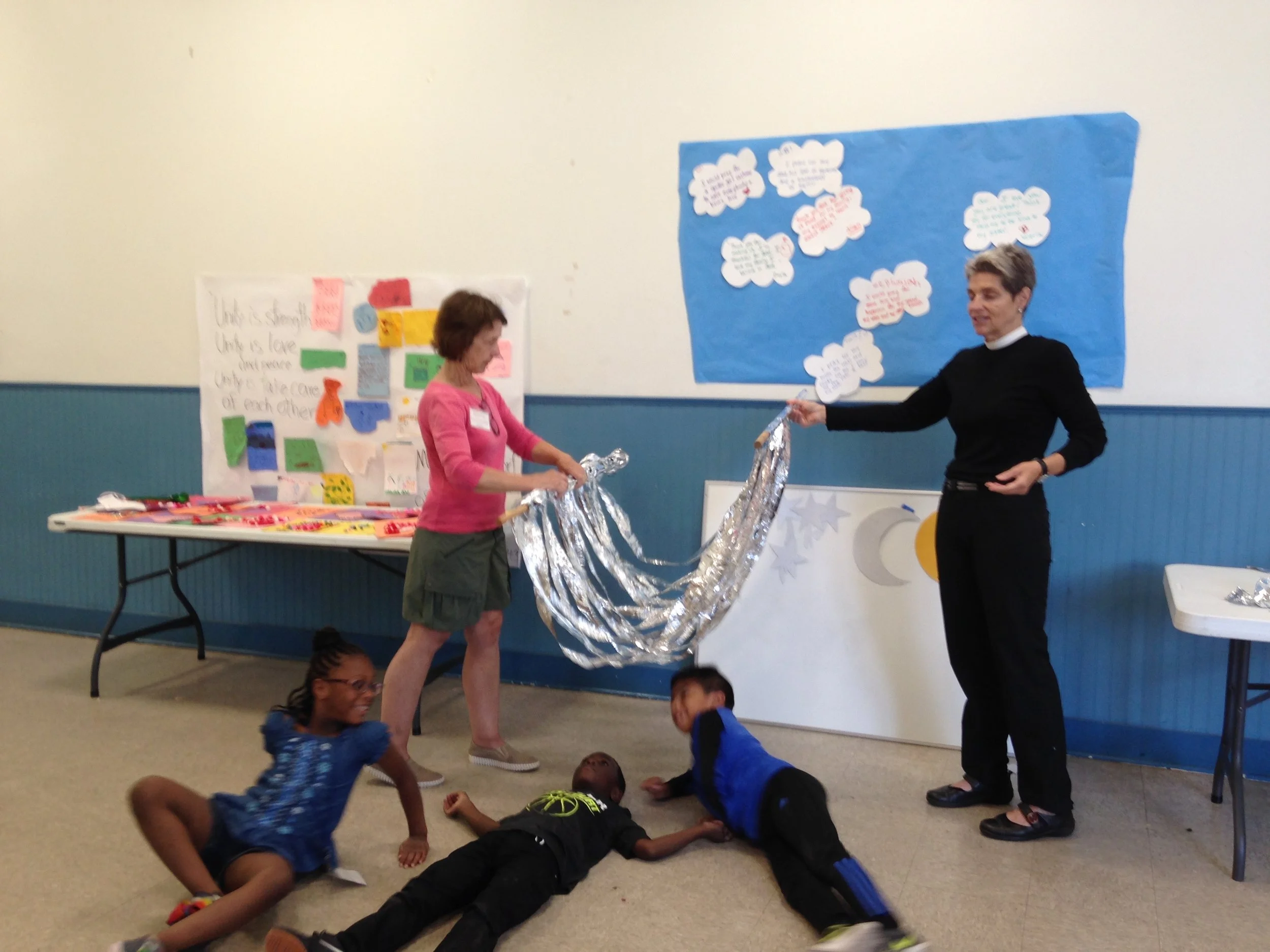 The Rev. Joanne tells a story about a farmer who prays to God from his heart. Then the campers wrote their own prayers.