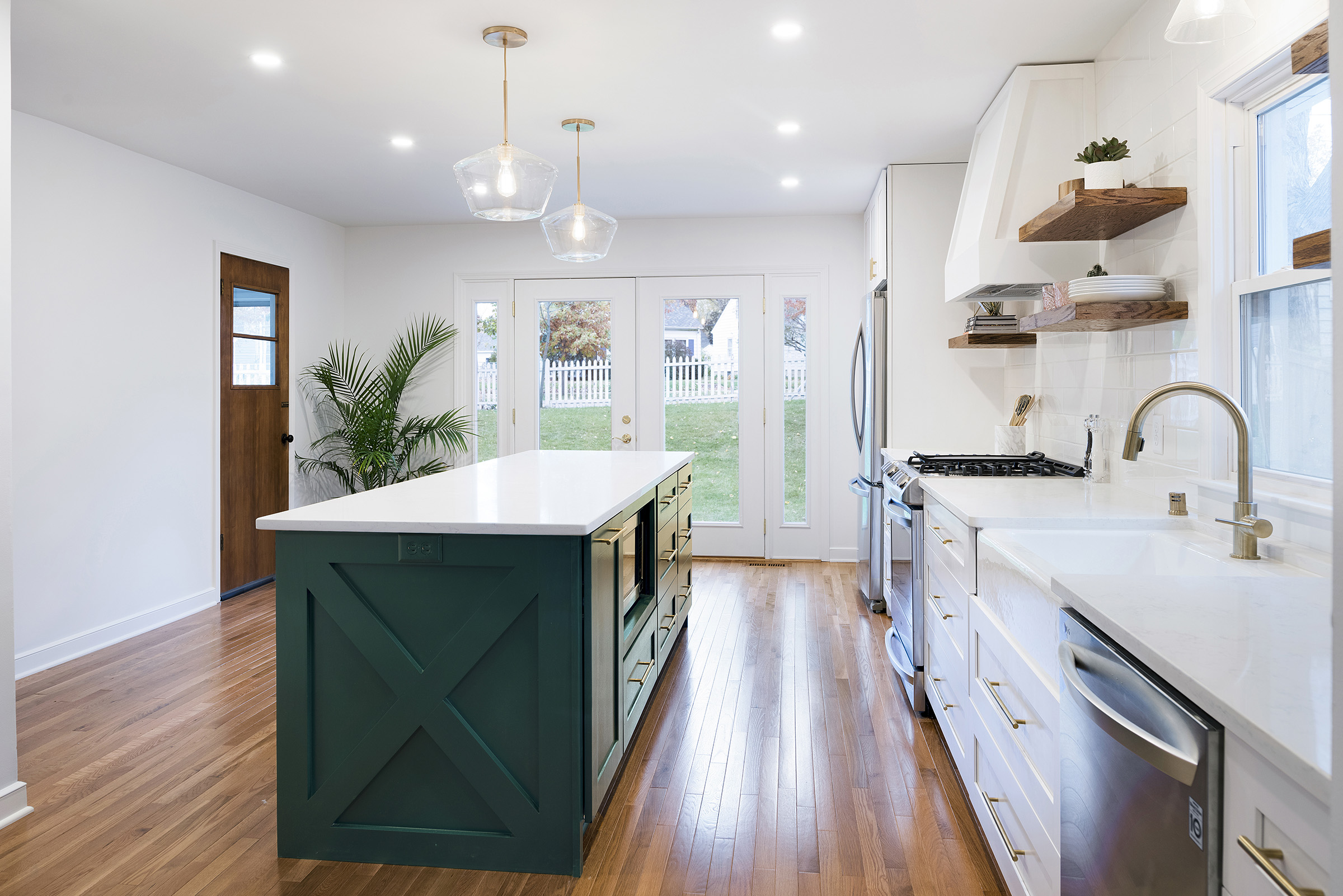 Kitchen remodel with gold pulls, new french doors, custom island