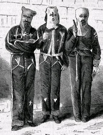 Mississippi Ku-Klux in the Disguises in Which They Were Captured, 1872. They were arrested in Tishomingo County, Mississippi for attempted murder. Wood engraving from photograph, Harper’s Weekly, 27 January 1872, (Public domain).