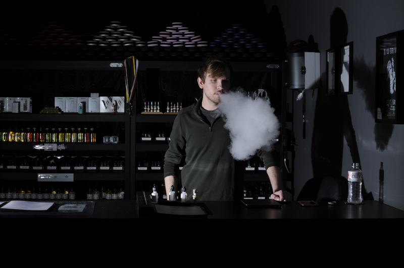 Ben Vickers, 23, has been working at a local vape shop for more than two years, and is now the manager of the establishment. The majority of his day consists of taking inventory, restocking shelves, and vaping.