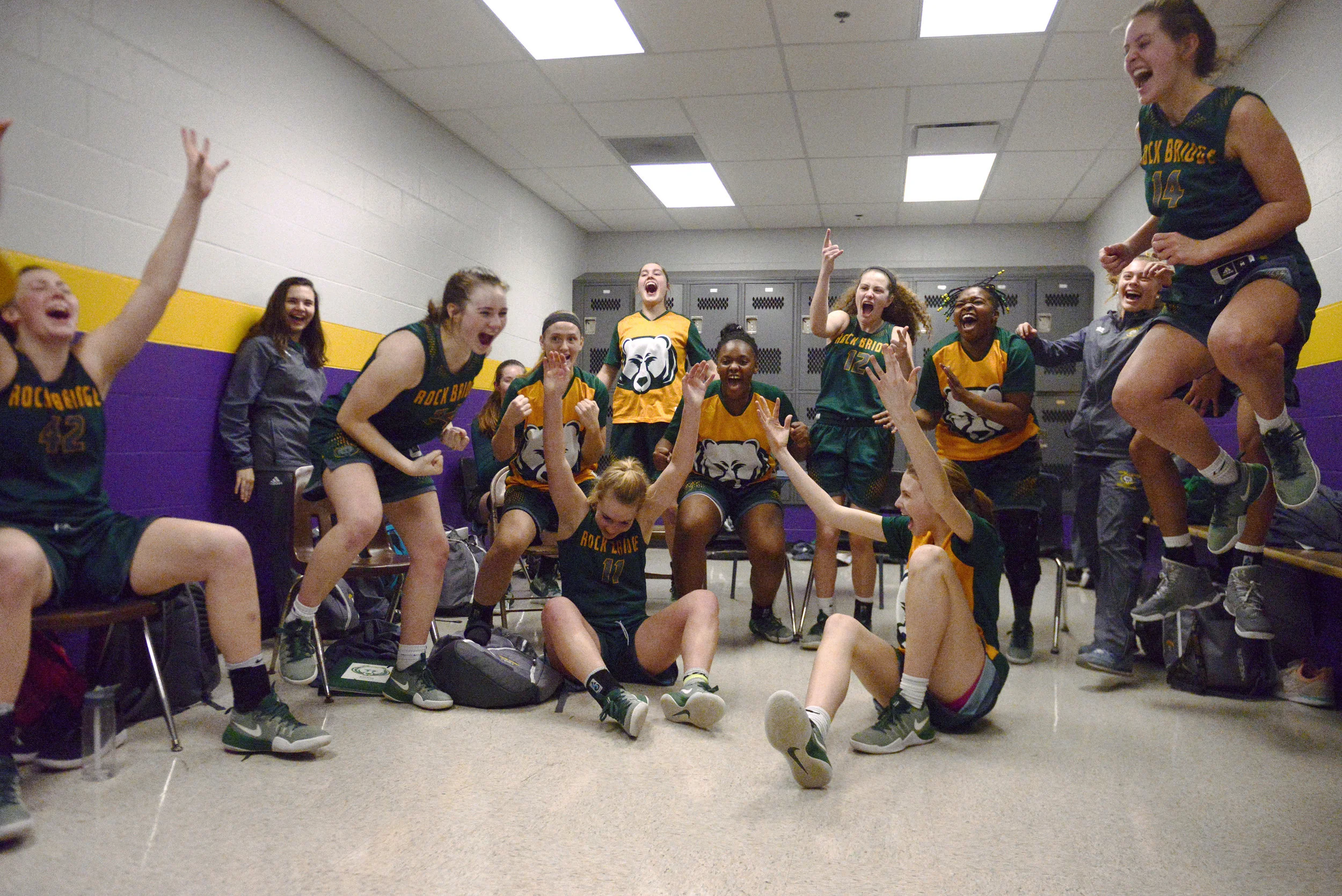  The Rock Bridge High School girls basketball team celebrates in the locker room after winning the Class 5 District 9 Championship against Blue Springs High South High School on Friday, March 3, 2017 in Columbia, Mo. Rock Bridge moved on to play in t