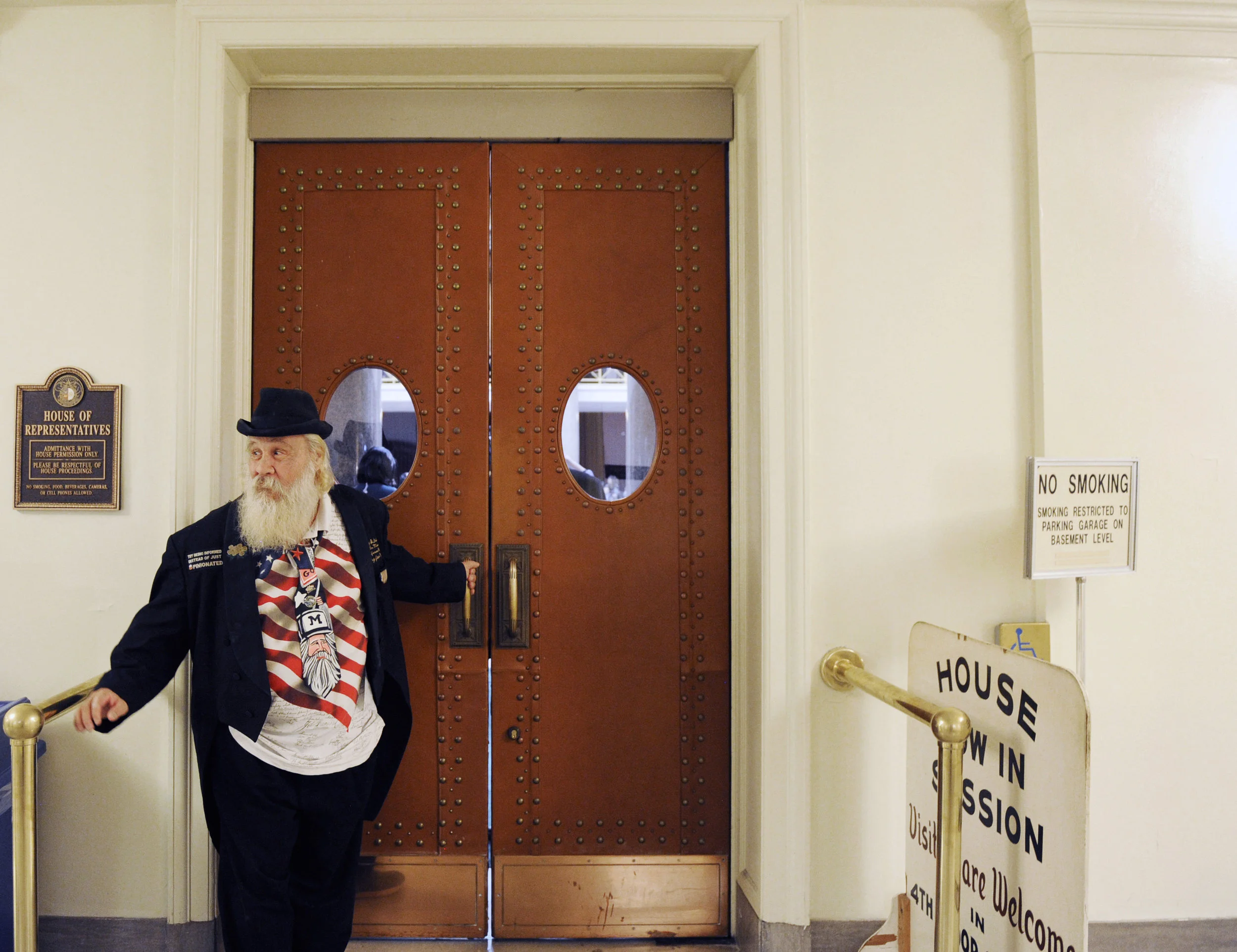  Leonard Steinman, who was a Democratic candidate for governor of Missouri in the 2016 election, attempts to open the door for a spectator of Governor Greitens'&nbsp;State of the State Address on Tuesday, Jan. 17, 2017. Steinman said Greitens kept hi