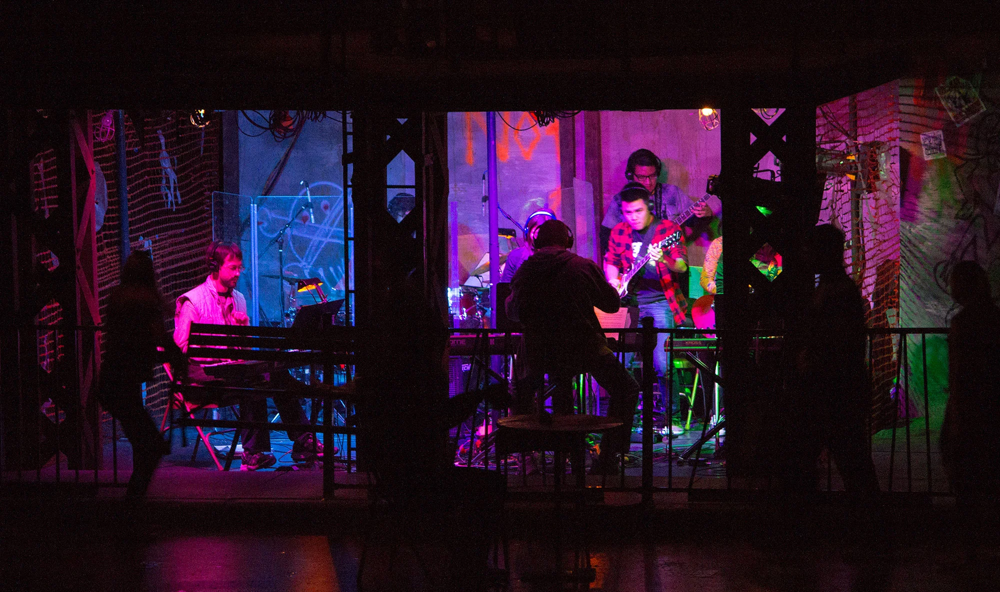 Highlight on band (embedded on stage) as they play during a transition. 