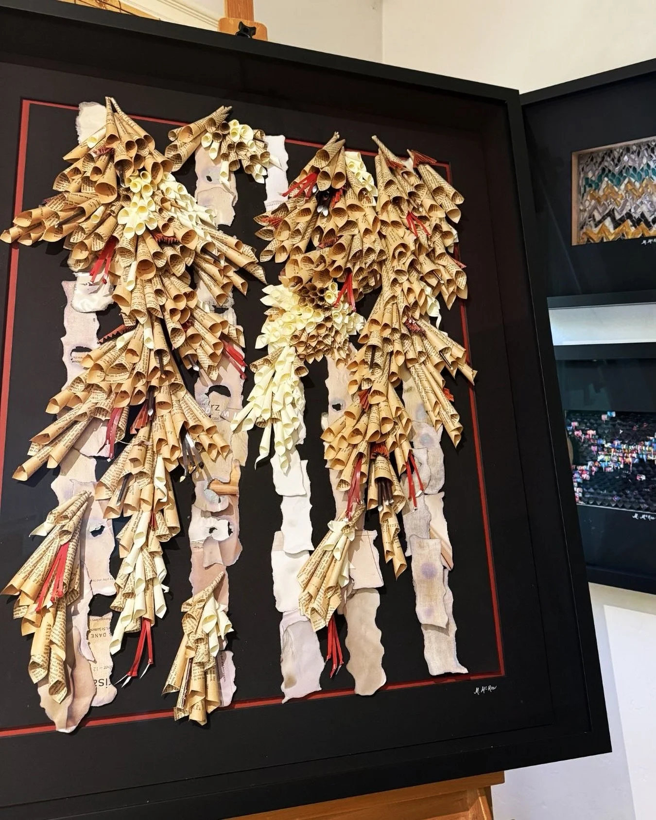Woodlands, framed and ready to be seen in person. 

Inspired by the layered beauty of a natural woodland, Woodlands transforms strips of recycled paper into a sculptural landscape of trees, shrubs, and undergrowth.

The long, torn strips suggest slen