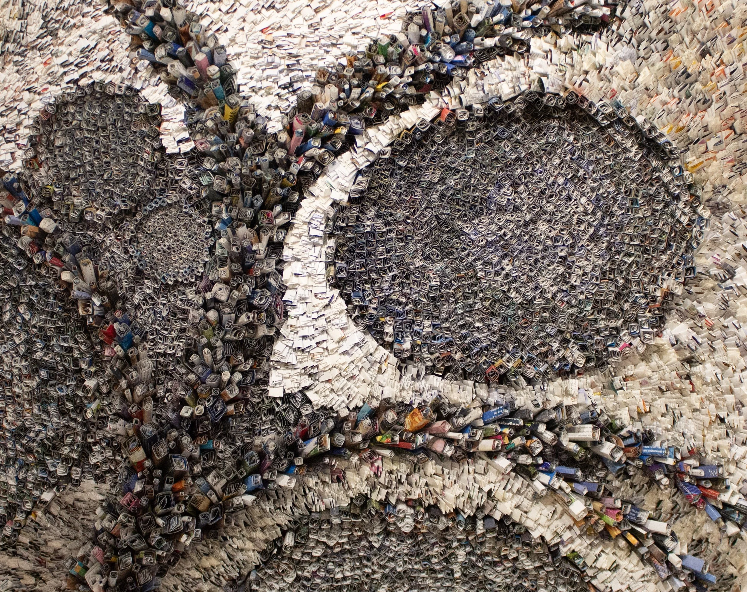 original paper art Metropolis by marilyn mcrae composed of thousands of rolled and folded magazine pages in the shapes of cities spreading out