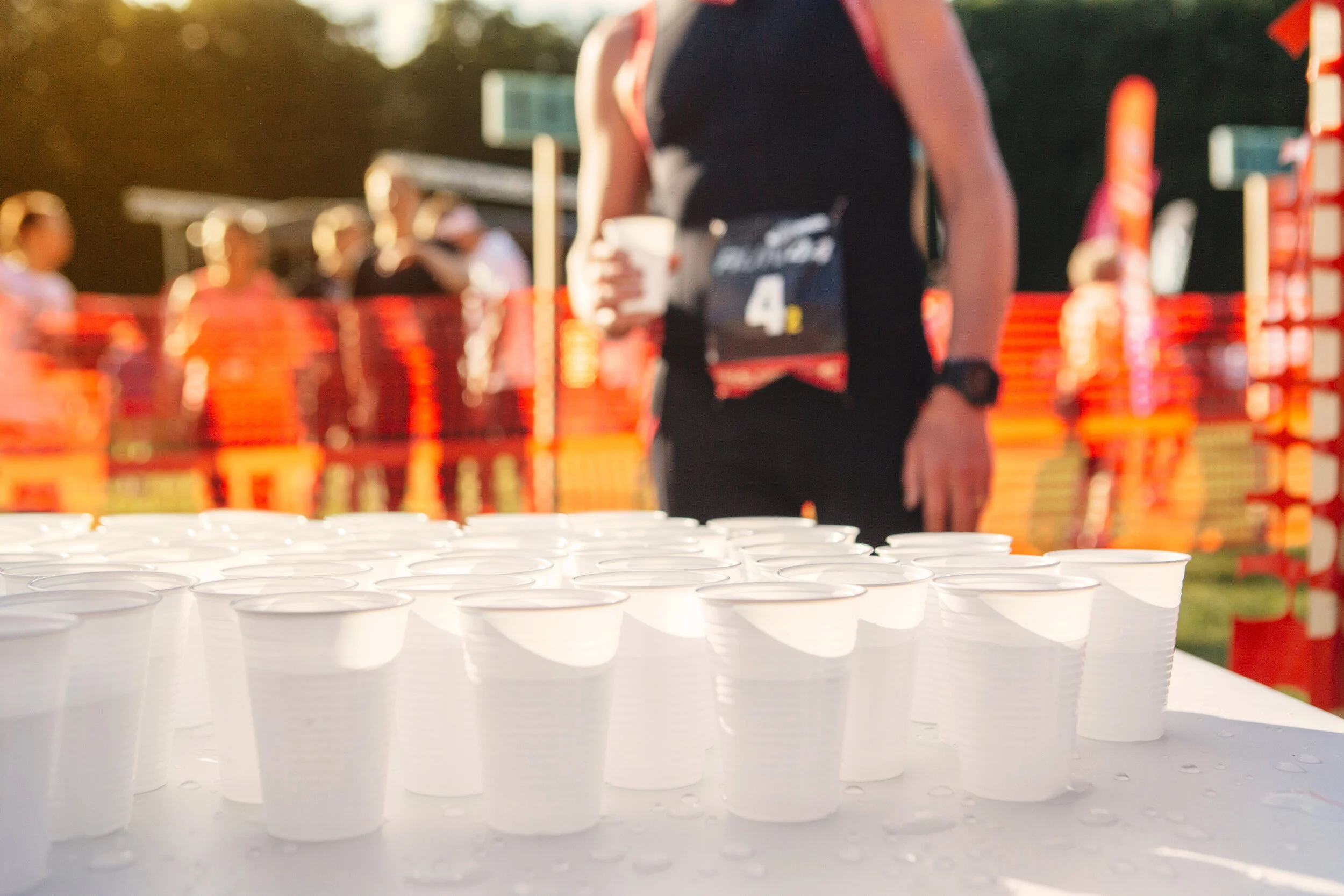 table-with-cups-of-water-at-sports-event-D6Q7YNR v2.jpg