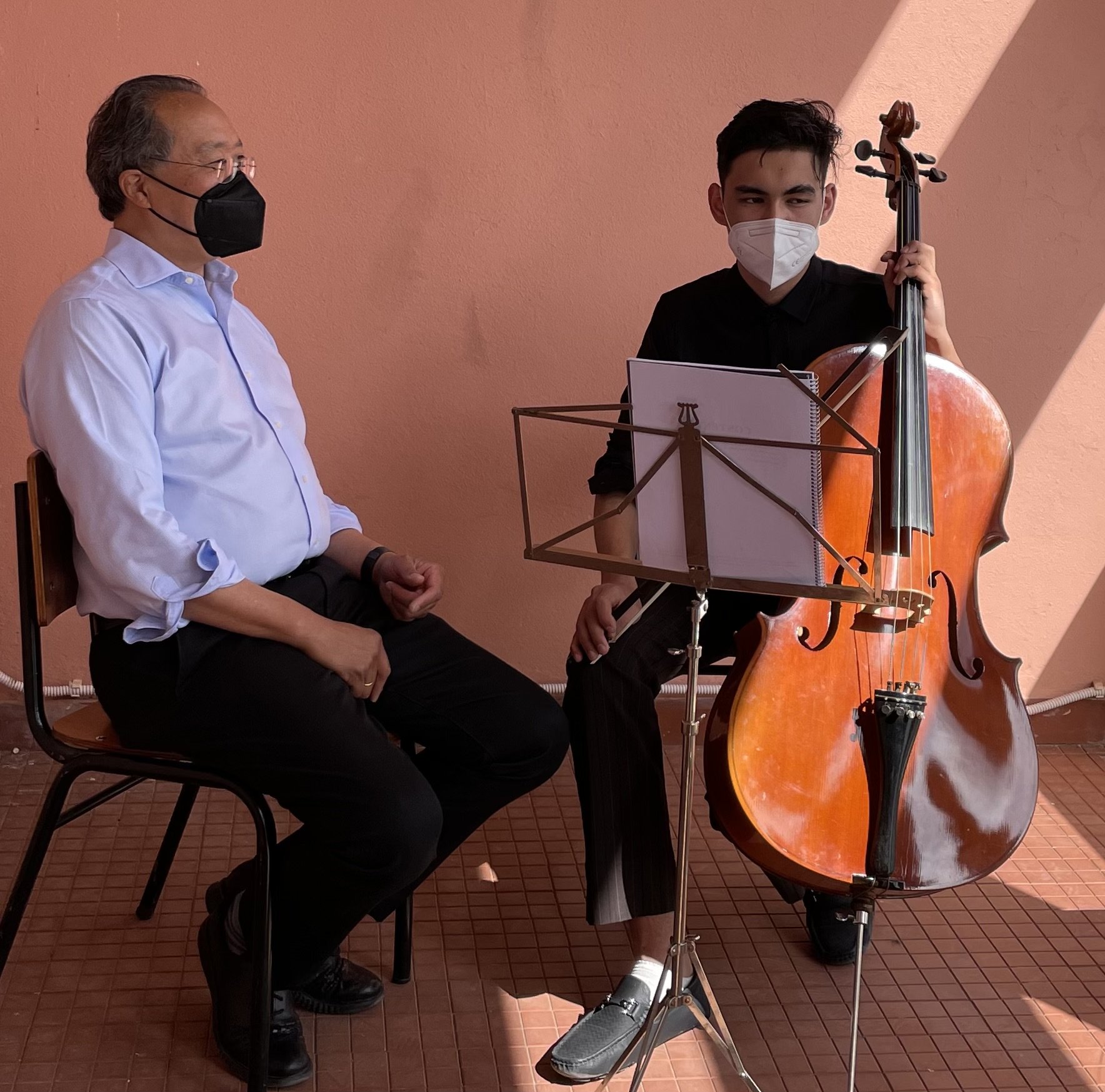 YY coaching an Afghan cellist.JPG