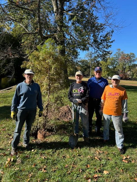 Friends of Watsessing Park Conservancy members prepare to plant one of 20 trees