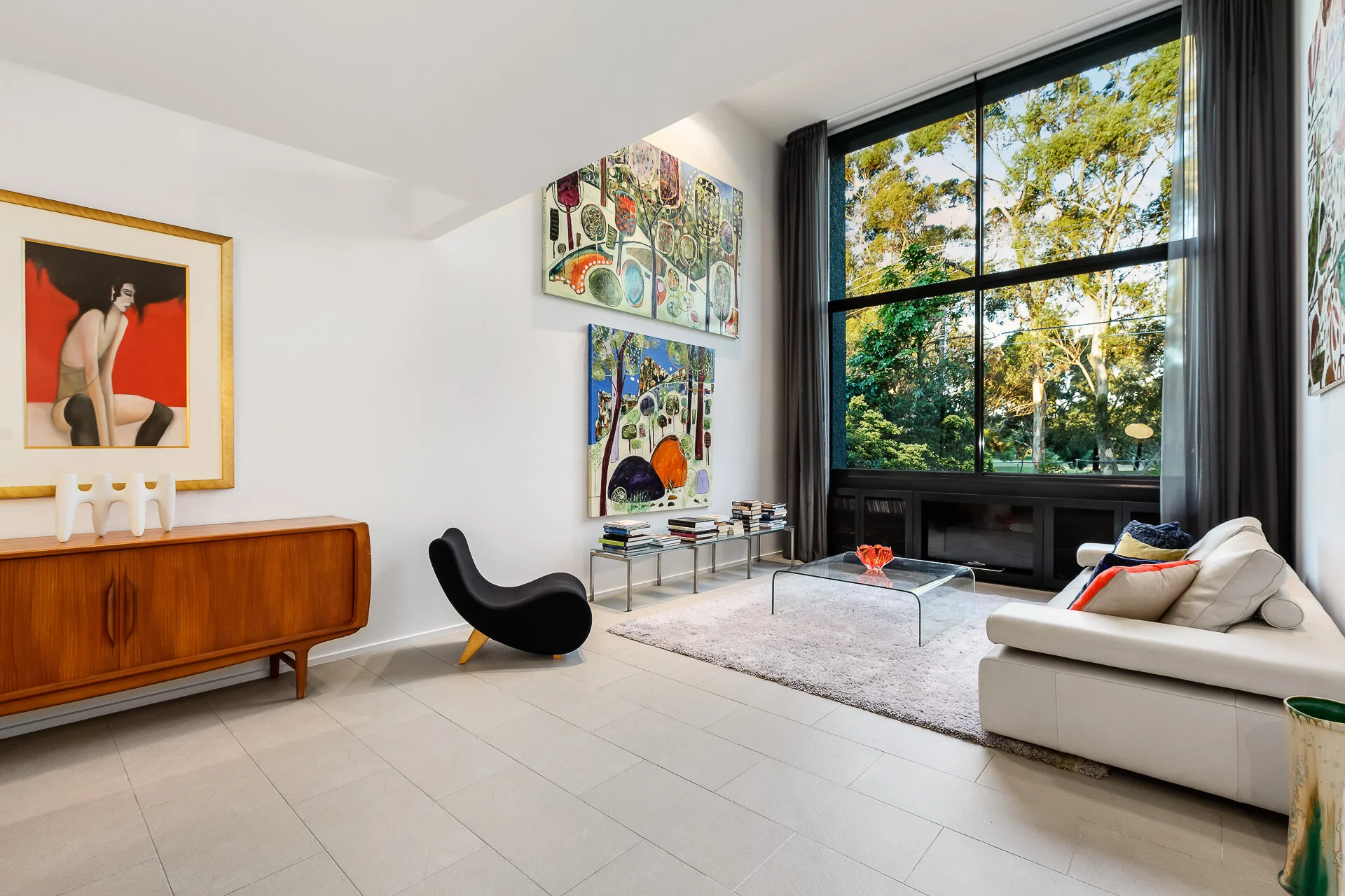  Soaring high volume ceilings leading to the large window wall capturing the picturesque golf course views. 