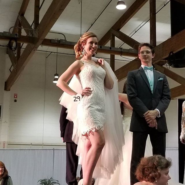 My lovely model has her detachable skirt on her shoulder! ♡♡♡ #detachableskirt #weddingdresses #runway #model #bridal #lovely #shortweddingdress #lace #corset