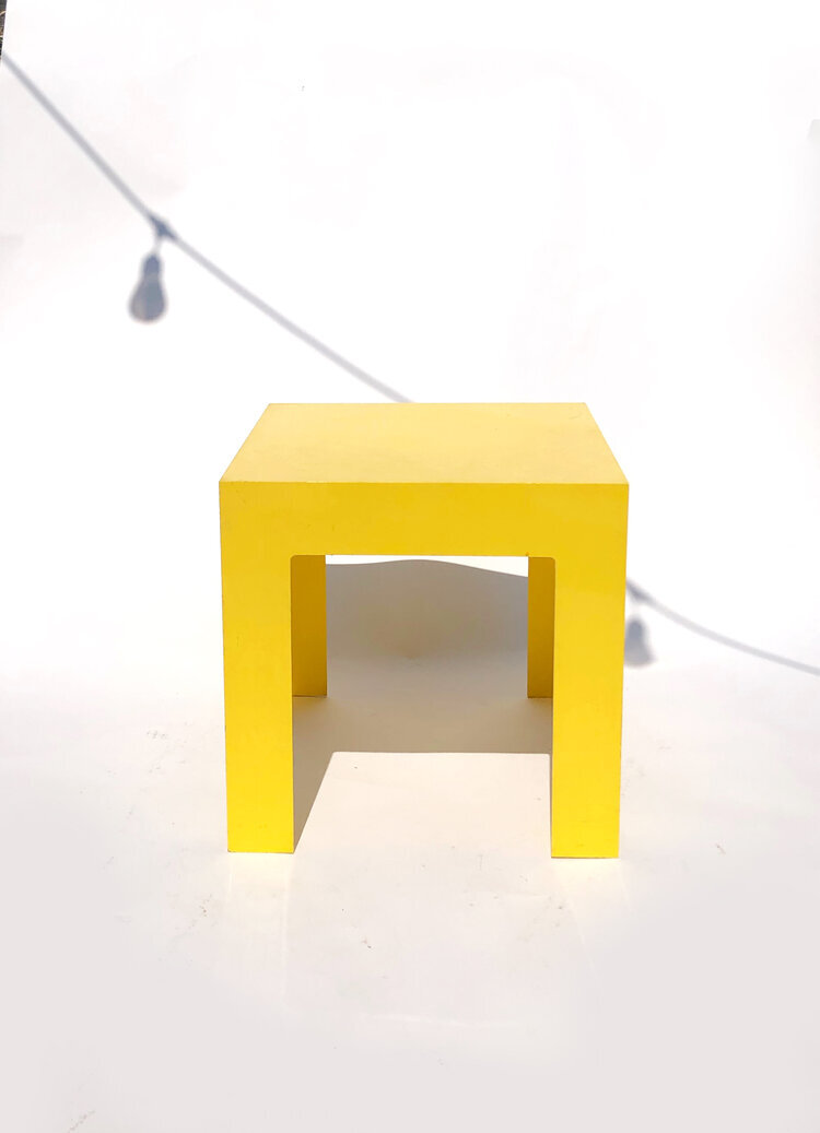 Relationships NYC - canary yellow plastic side table