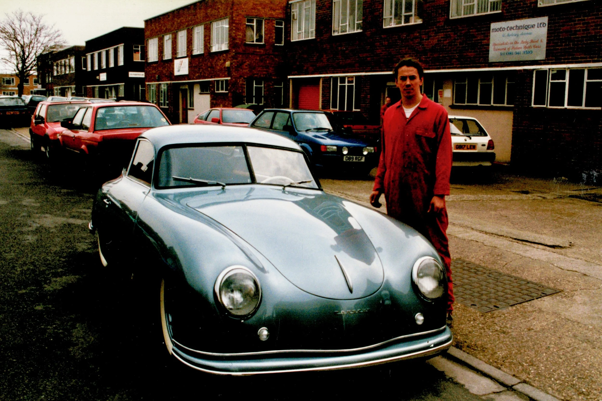 Proud trimmer stands next to one of his first concours winning cars.