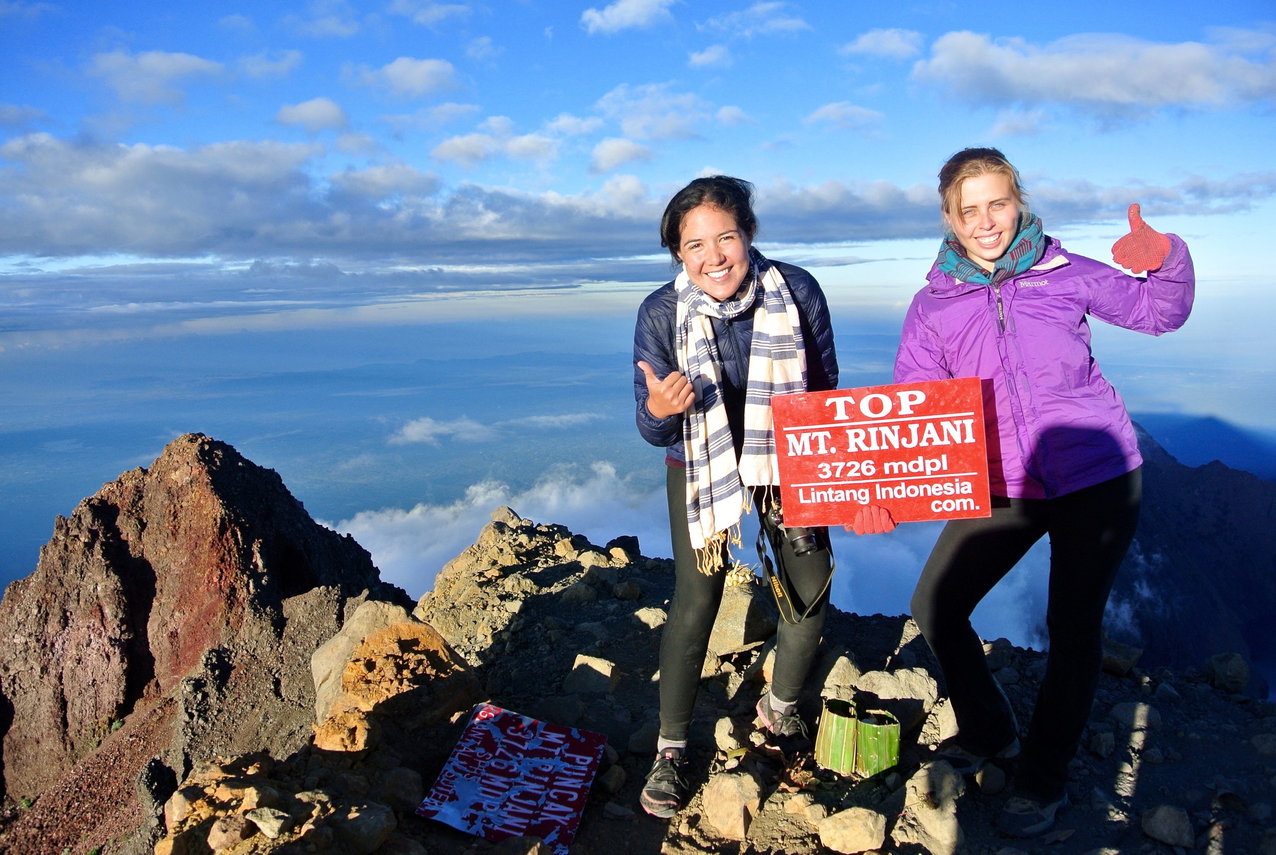 Team members Zoe and Mariko rocking rogues at the summit of Mount Rinjani in Indonesia. 