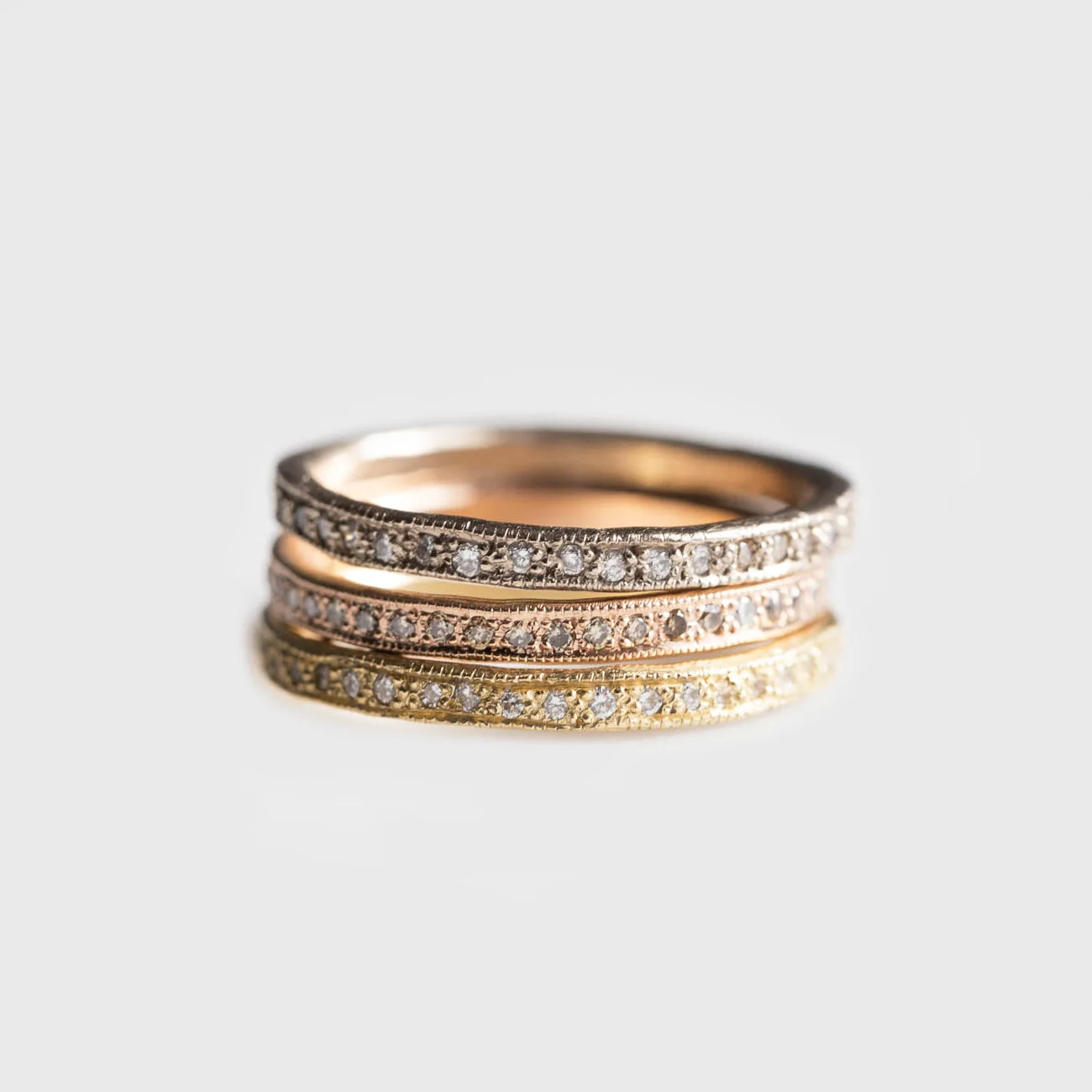 Stack of Gold and Diamond Eternity Rings