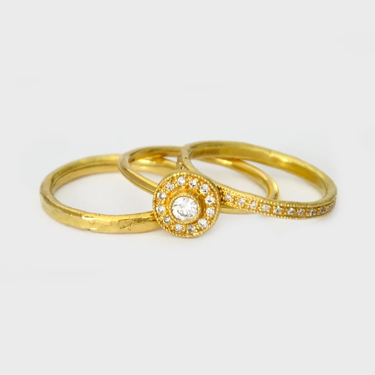 Stack of Yellow Gold White Diamond Engagement Rings