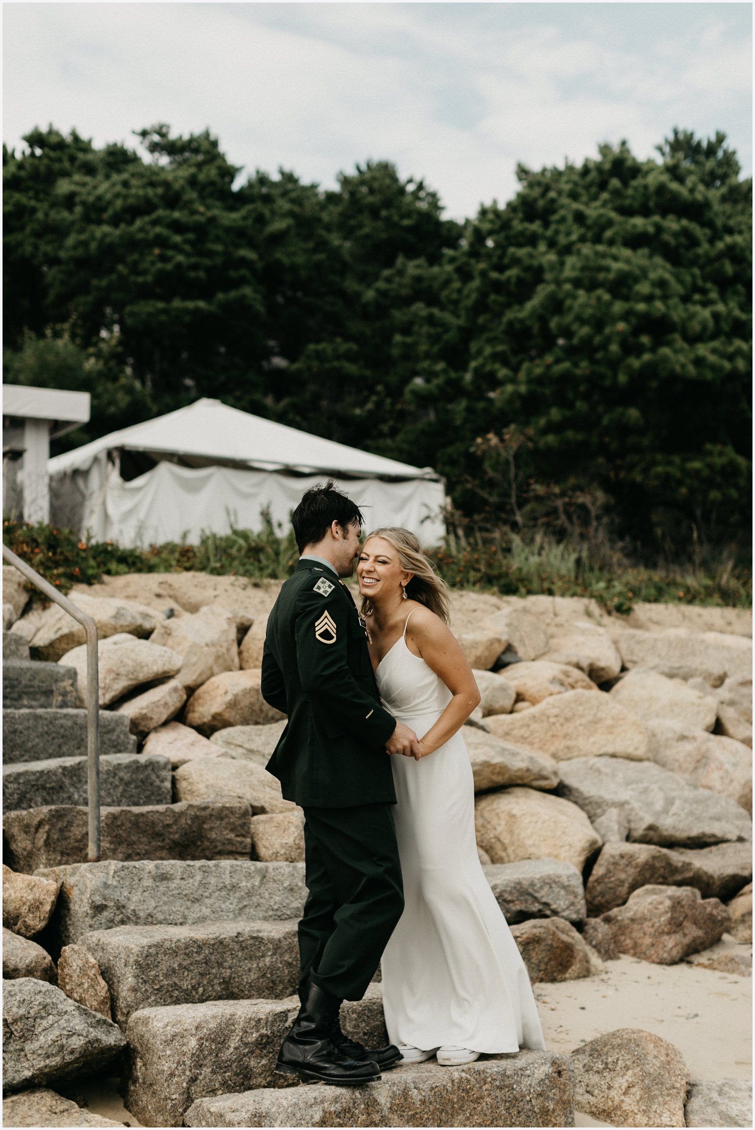 Bride and groom at the beach by the Chequessett Yacht &amp; Country Club