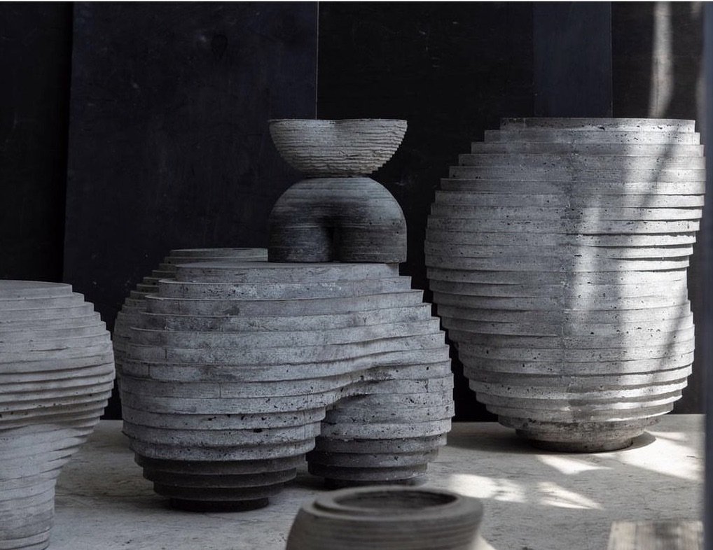 A Grouping Of Concrete Stools And Vessels