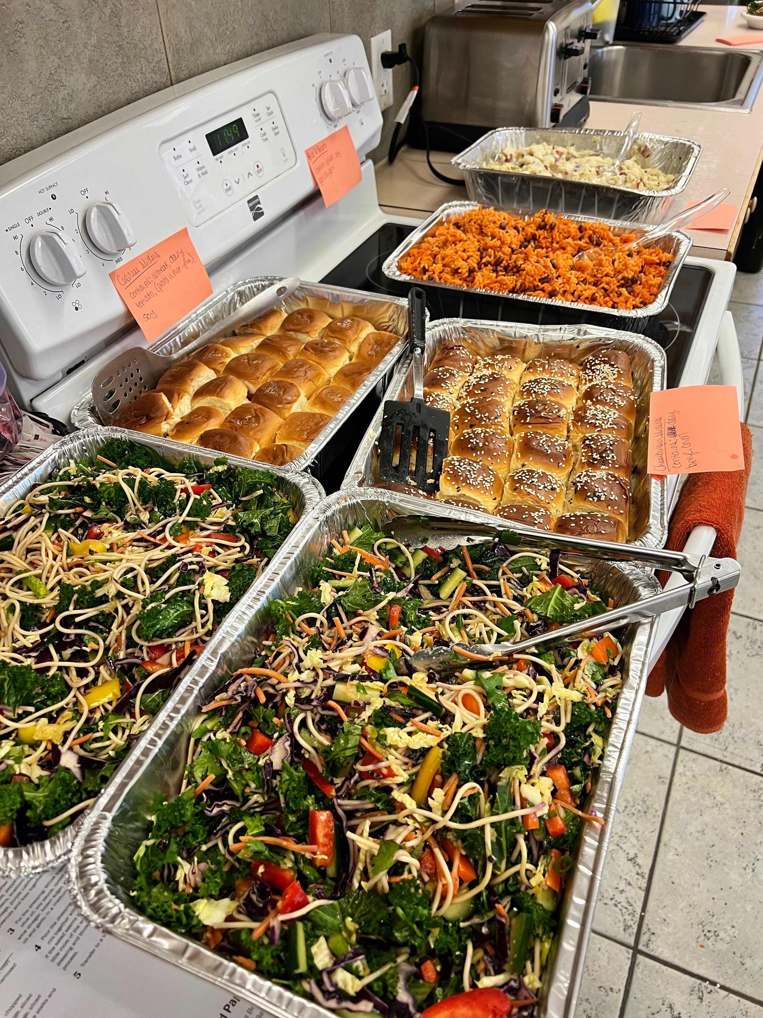  Asian noodle salad, cheeseburger sliders, caprese sliders, rice with beans, and potato salad 