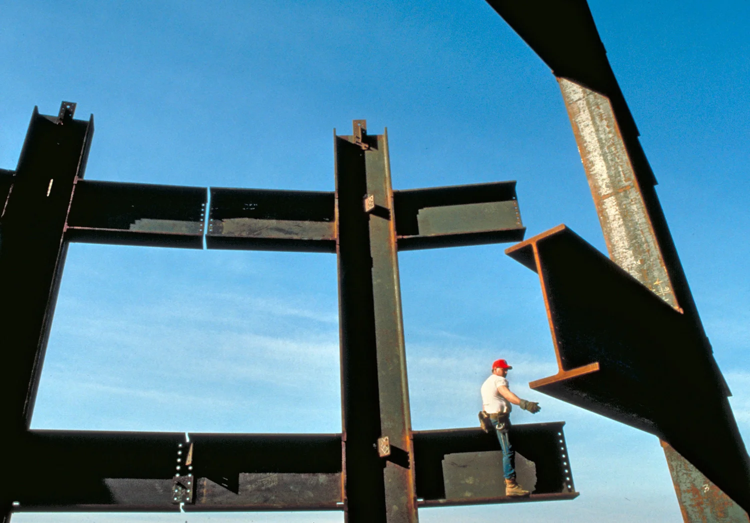 iron worker near top of International Place
