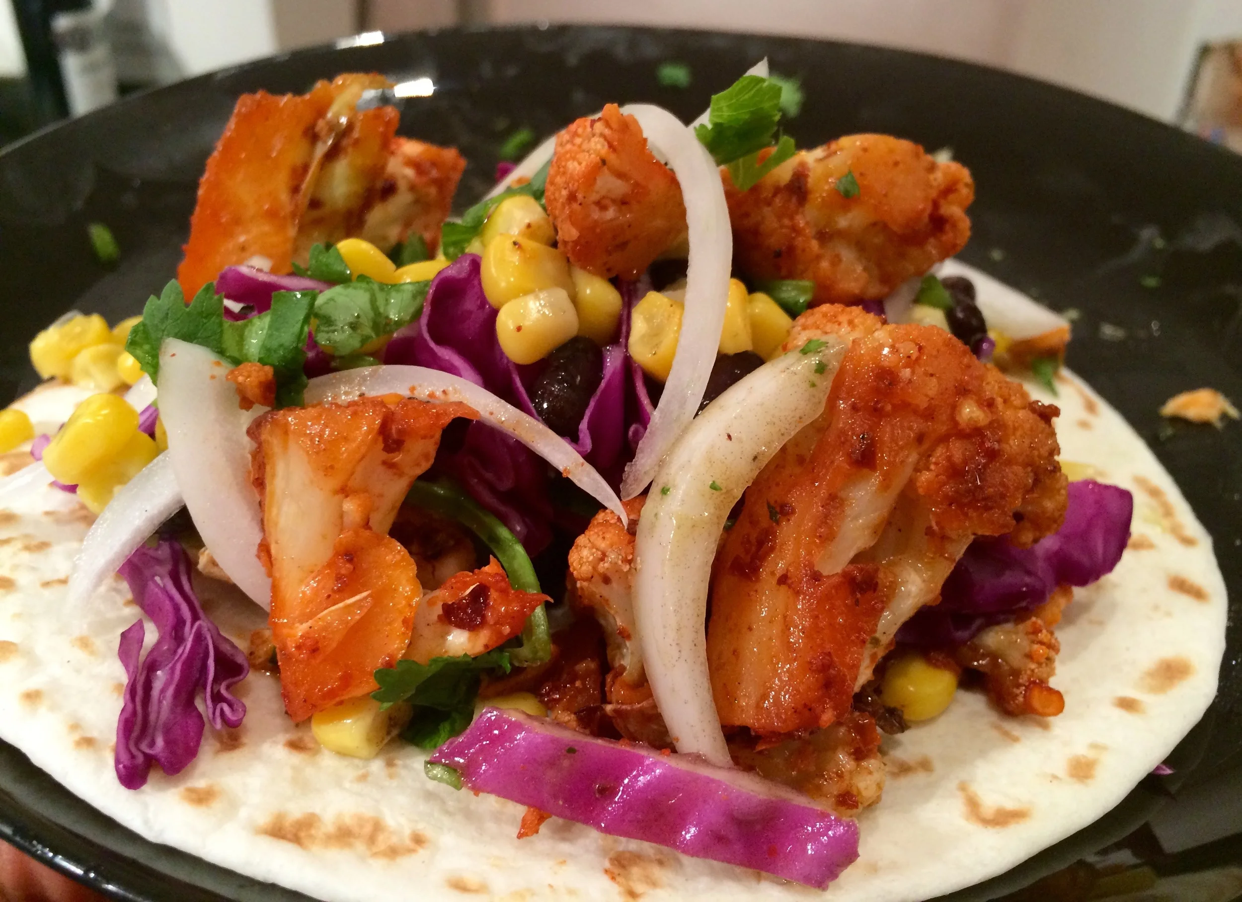 spicy baked cauliflower and salmon tacos