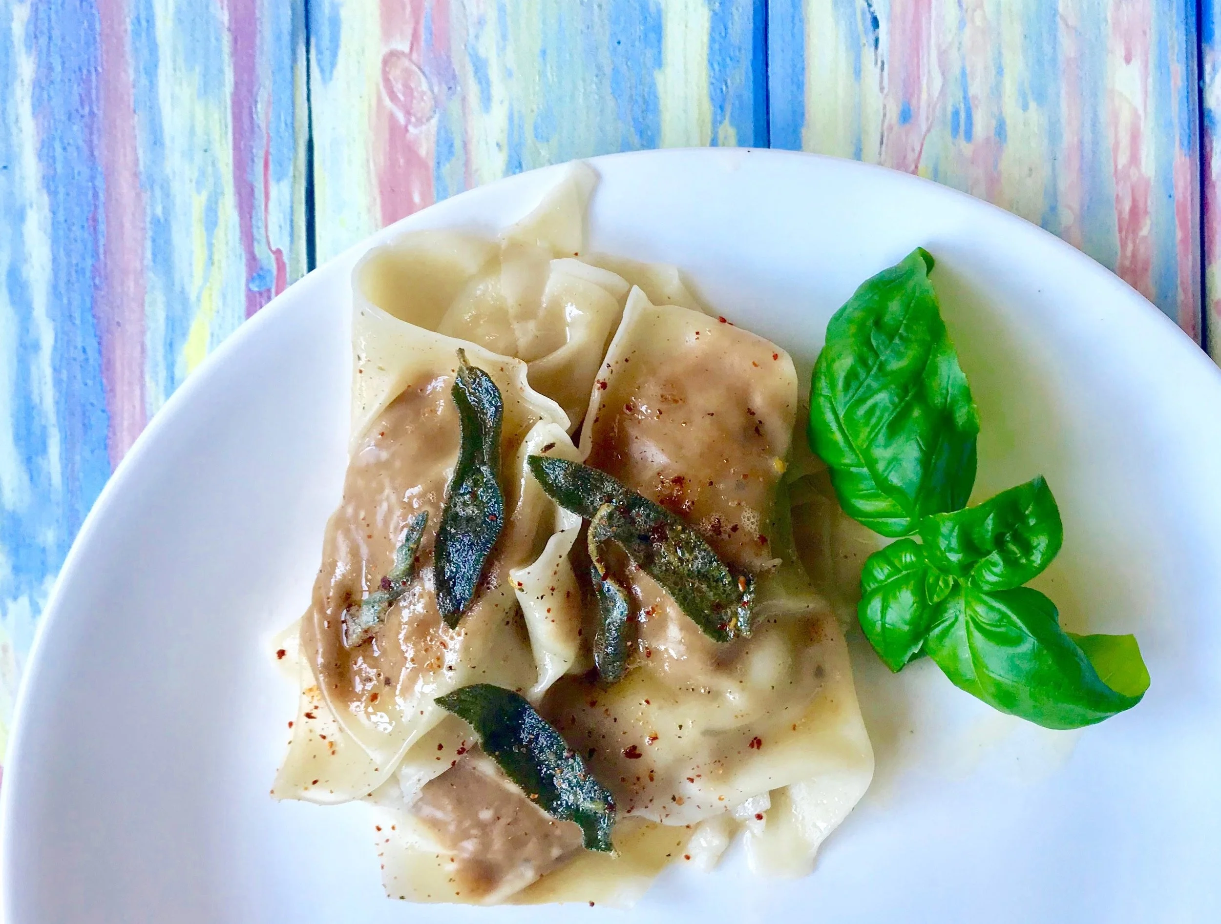 Butternut squash ravioli in a brown butter-sage sauce