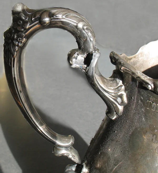 trophy handle melted by torch