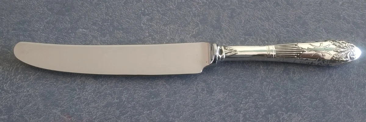 Antique sterling silver handle with new stainless steel blade