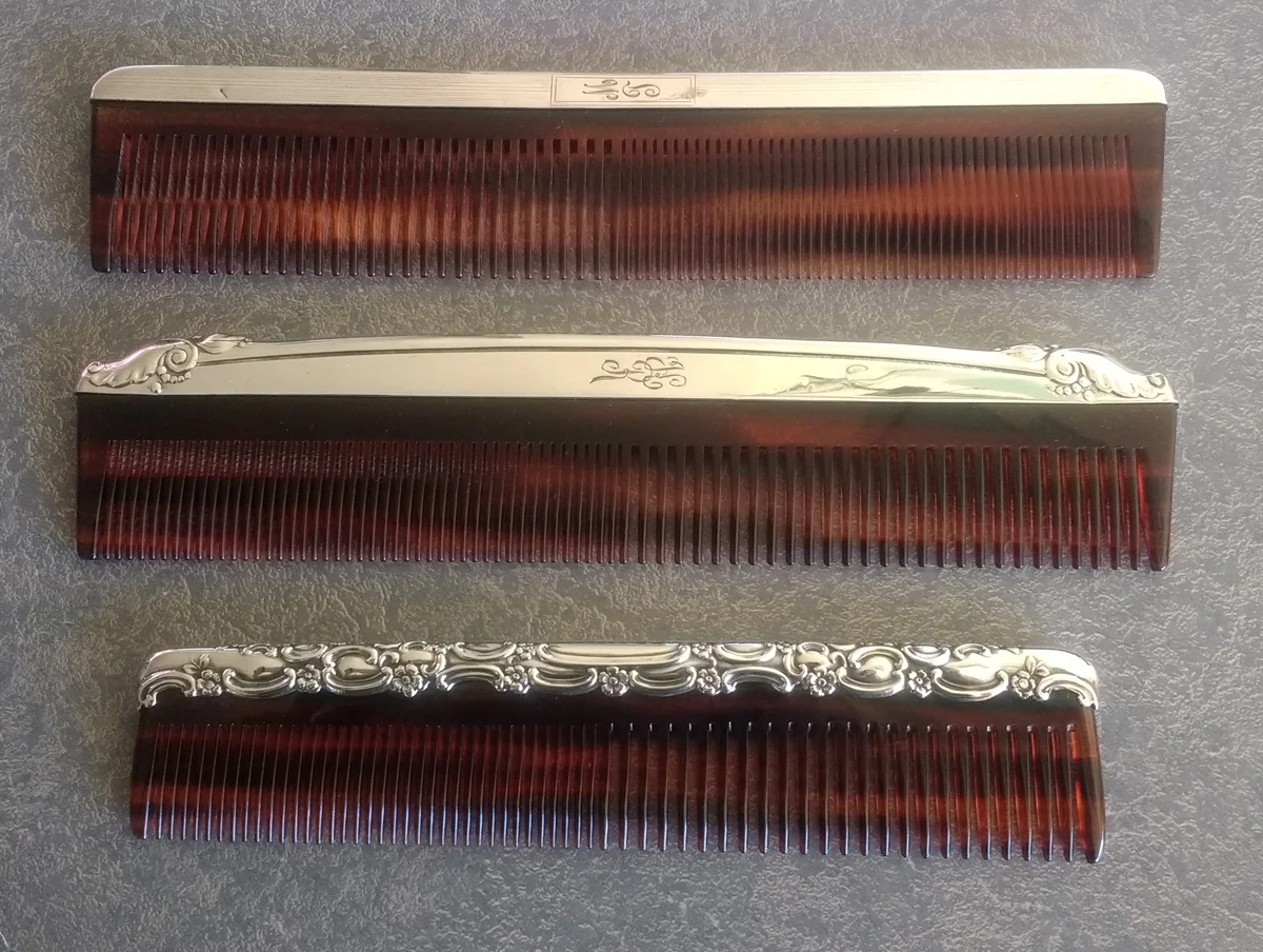Notice that the engraving on the sterling silver comb fitter is different for each comb.