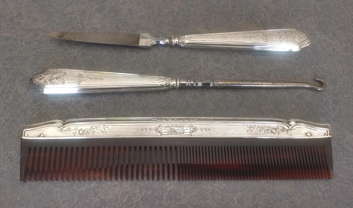 Antique file and button hook with sterling silver handles and matching comb