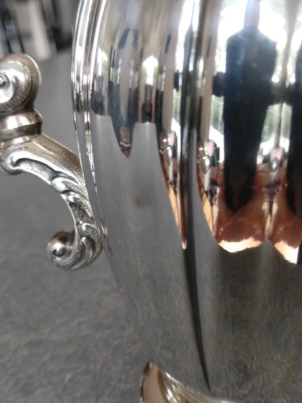 dent in sterling silver creamer