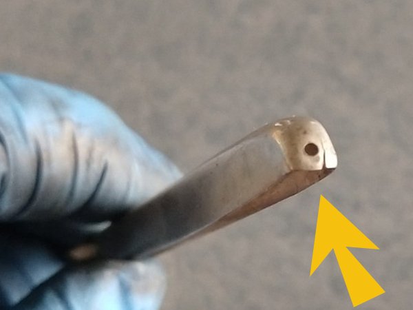 end of sterling silver comb fitter with bad rivet hole