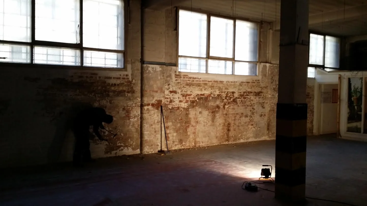 At least 7 layers of paint beore we hit the late 19th century brick